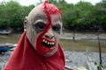 An unidentified person is seen wearing a horror costume and mask in the Acupe district in the city of Santo Amaro, Bahia Royalty Free Stock Photo