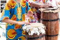 Members of Candomble are playing a percussion instrument during a religious demonstration in the city of Saubara, Bahia