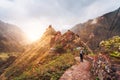 Santo Antao Island Cape Verde. Girl hiking along the trekking route to verdant Xo-Xo valley. Backlit by warm sunset