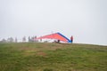 People trying to go hang gliding at Pico Agudo mountain top on a foggy day Royalty Free Stock Photo