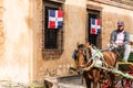 SANTO DOMINGO, DOMINICAN REPUBLIC - AUGUST 8, 2017: The coachman in a retro carriage on a city street. Copy space for text. Royalty Free Stock Photo