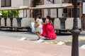 SANTO DOMINGO, DOMINICAN REPUBLIC - AUGUST 8, 2017: Two women in beautiful dresses on a city street. Copy space for text.