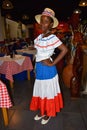 Santo Domingo, Dominican Republic. Girl in traditional Dominican dress. El Conde Street, Colonial Zone.