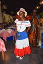 Santo Domingo, Dominican Republic. Girl in traditional Dominican dress. El Conde Street, Colonial Zone.