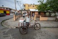 Man With Tricycle With Trolley, Transporting Load Of Reused Buckets In Los Guandules Neighborhood Royalty Free Stock Photo
