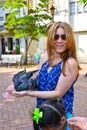 Santo Domingo, Dominican Republic. Woman feeds pigeons on Columbus Park, Colonial Zone of Santo Domingo.