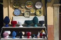 Detailed view shelves with different colorful vases, jugs, plates. Gift shop in the street