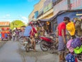 Santo Tomas Public Market with motorcycle rideres and some markket vendors in focus in Santo Tomas Public Market, Santo Tomas