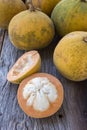 Santol on wood background. Royalty Free Stock Photo