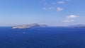 Santorini, Caldera. View of the beautiful blue sea and the three volcanic islands in the middle of Caldera. In the background is Royalty Free Stock Photo