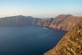 Santorini caldera view from the top of the hill. Blue sky and water. Royalty Free Stock Photo