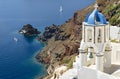 Santorini classic view with white belfry - Oia village in Greece