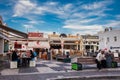 Tourists and locals at a food court at Fira city in Santorini island Royalty Free Stock Photo