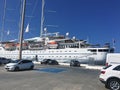 Santorini, Greece August 4, 2019: A huge tourist ship in the port on a bright sunny day. Cruise ship docked in port. Concept: Royalty Free Stock Photo