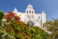 Santorini church with flowers in the front