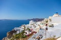 Santorini, Greece - August 7, 2021: View over the roofs of the typical houses of Santorini, island in the cyclades archipelago in Royalty Free Stock Photo