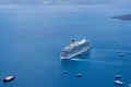 Santorini/Greece: 09/07/2019: Big cruise ship in the middle of the sea in Santorini, Greece