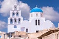 Santorini Greece Church with bells and cross against blue sky