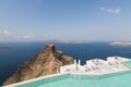 SANTORINI, GREECE - MAY 2018: View from Imerovigli village over Aegean sea, Skaros rock and volcano caldera with luxury hotel and Royalty Free Stock Photo