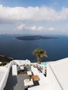 SANTORINI, GREECE - MAY 2018: View over Aegean Mediterranean sea and volcano caldera with luxury hotel and infinity swimming pool Royalty Free Stock Photo