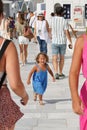 Santorini, Greece, September 20 2018, little blonde girl cries because she does not see her parents in Oia