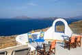 Restaurant overlooking the caldera and volcano in Akrotiri, Santorini island. Greece