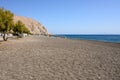 View of black sand beach of Perissa on the island of Santorini. Cyclades, Greece Royalty Free Stock Photo