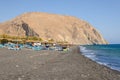 View of black sand beach of Perissa on the island of Santorini. Cyclades, Greece Royalty Free Stock Photo