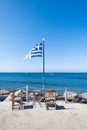 Greek flag and blue sky at a dock at Santorini island, Greece Royalty Free Stock Photo