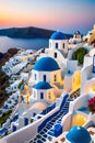 Santorini with the iconic whitewashed buildings, cobalt-blue domes, Aegean sea, cliffs, sunset, travel destination Royalty Free Stock Photo