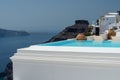 Santorini infinity pool detail on Fira and Oia town in summer traveling time