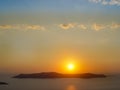 Santorini island with Firostefani Church against the sunset