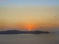 Santorini island with Firostefani Church against the sunset