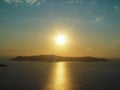 Santorini island with Firostefani Church against the sunset