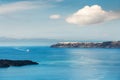 Santorini island, Greece. Blue sea and the blue sky with white clouds Royalty Free Stock Photo