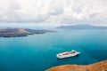 Santorini island, Greece. Cruise ship near the coast. Blue sea and the blue sky Royalty Free Stock Photo