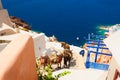 Santorini island, Greece. Donkeys walk down the stairs