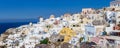 Santorini island, Greece - October 13, 2014: Panoramic view of Oia village - famous place with white houses and windmill