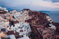 Santorini island Oia sunset landscape. Traditional white houses and castle ruins with sea view. Travel to Greece Royalty Free Stock Photo