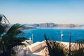 Santorini landscape of Aegean sea with big passenger cruise ship by volcano island. Caldera view. Tholos Naftilos Royalty Free Stock Photo
