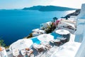 Santorini Oia village during sunset whit luxury hotels and whitewashed buildings in Santorini Island a luxury vacation