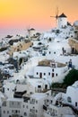 Santorini at Sundown. The famous town of Oia in the sunset. Traditional old windmills. Romantic holidays. Oia, Santorini, Greece Royalty Free Stock Photo