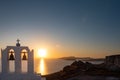 Santorini sunset with a church`s bell tower Royalty Free Stock Photo