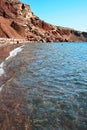 Santorini: Tourists at the Red Beach, one of its most famous and beautiful beaches