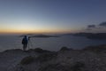 Santorini, view of the Caldera after sunset. In the foreground the end of the cliff and in the background the sea and the coast of Royalty Free Stock Photo