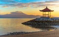 Sanur beach and Mount Agung volcano at sunrise, Bali, Indonesia Royalty Free Stock Photo