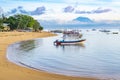 Sanur beach and Mount Agung volcano at sunrise, Bali, Indonesia Royalty Free Stock Photo