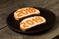 Sanwiches with red caviar 2018 and 2019 years text