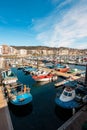 Sanxenxo, Spain - February 8, 2023: Moored fishing boats on the harbor of Sanxenxo famous touristic destination in