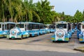 Parking with fun vehicles in the form of a blue steam locomotives for carries tourists and visitors on the territory of Buddhist